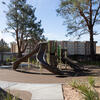 Play structure with slides for preschool students on the playground at CECE South.